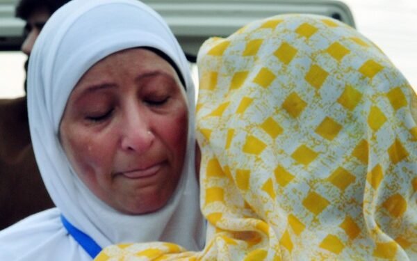 Srinagar, June 07 (ANI): A pilgrim embraces her family member as she leaves for Hajj pilgrimage to Mecca, Saudi Arabia, in Srinagar on Wednesday. The first batch of 630 pilgrims leaves for Saudi Arabia. (ANI Photo)